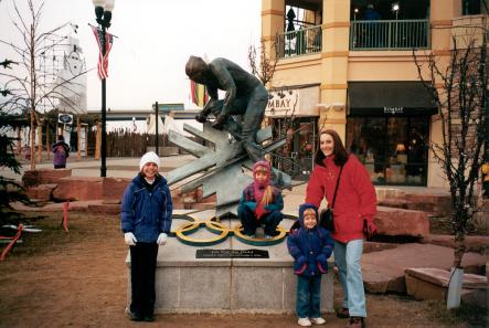 Nosack girls by an Olympic statue